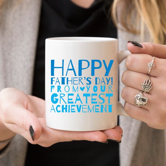 A white ceramic mug featuring a funny design, perfect for Father's Day gifts, showcasing vibrant colors and printed on both sides.