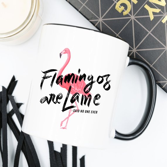 A colorful flamingo-themed coffee mug with a humorous quote, perfect for coffee lovers and gift-giving.