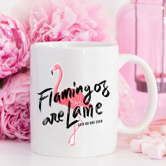 A colorful flamingo-themed coffee mug with a humorous quote, perfect for coffee lovers and gift-giving.