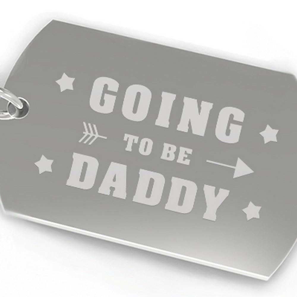 A stylish 'Going To be Daddy' key chain made of durable nickel plate, featuring an engraved design, perfect for new dads.