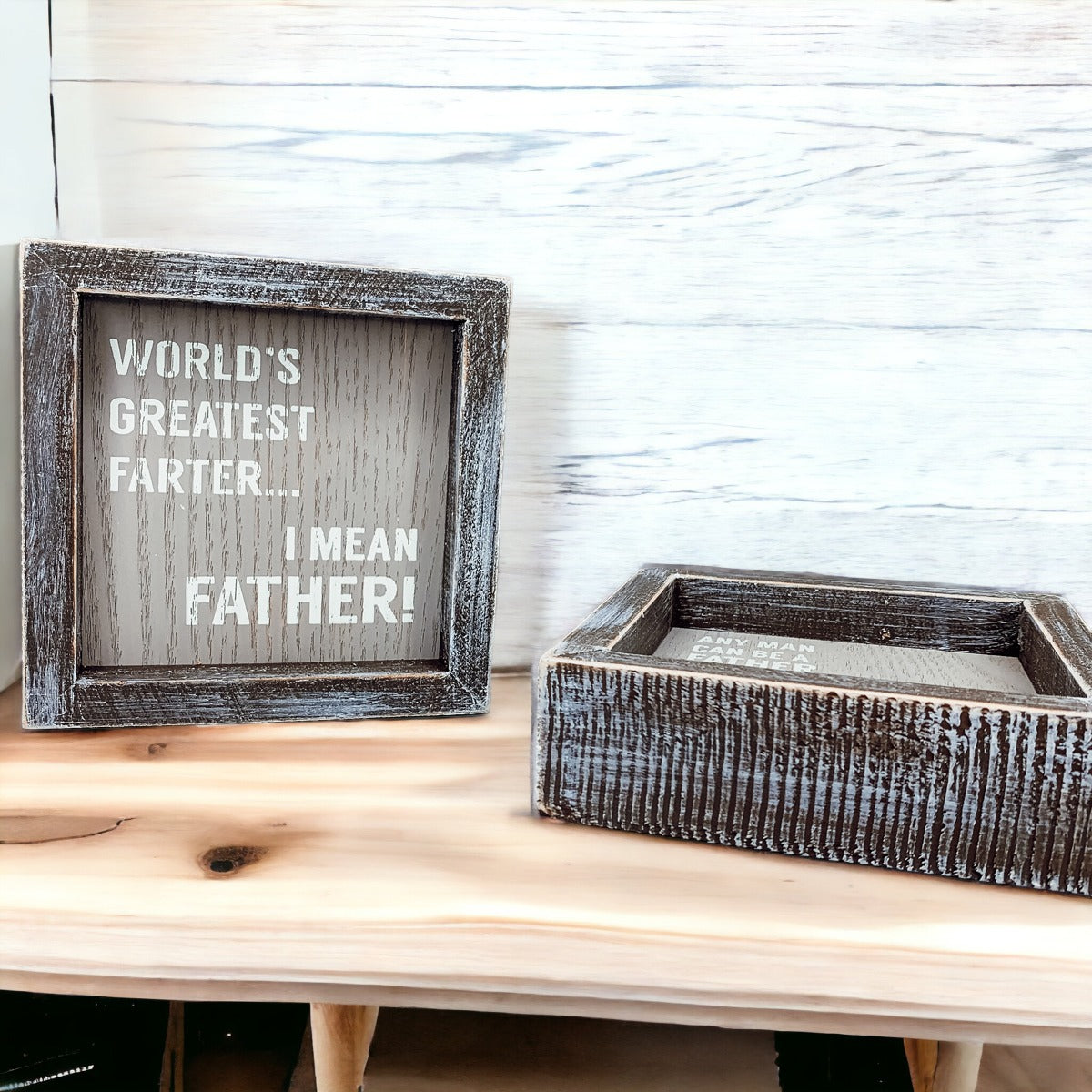 Handmade wooden sign reading 'World's Greatest Farter...I Mean Father' in distressed gray and white colors.