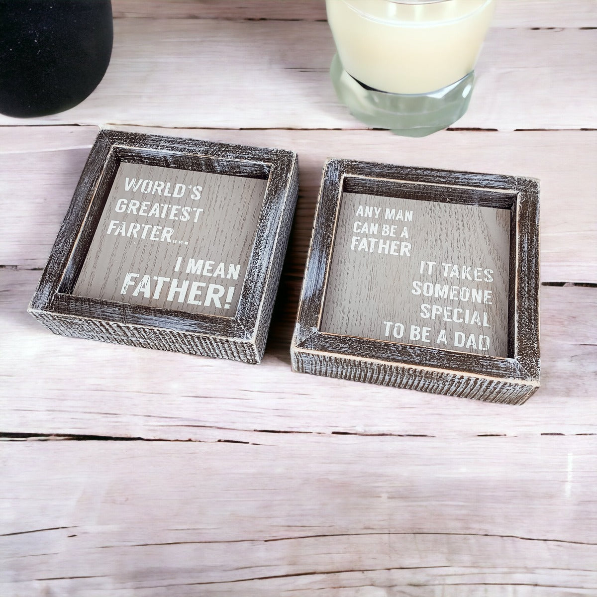 Handmade wooden sign reading 'World's Greatest Farter...I Mean Father' in distressed gray and white colors.