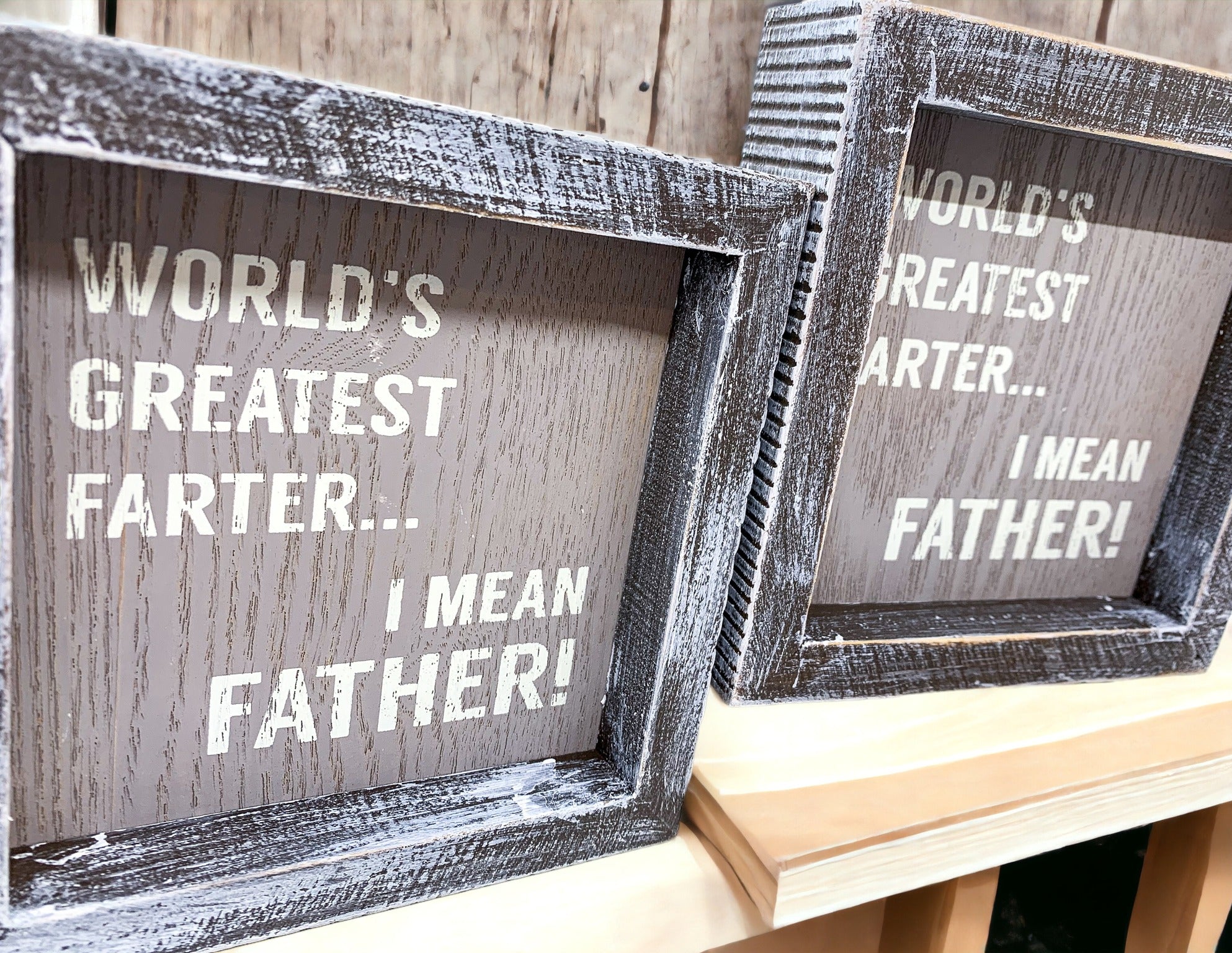 Handmade wooden sign reading 'World's Greatest Farter...I Mean Father' in distressed gray and white colors.