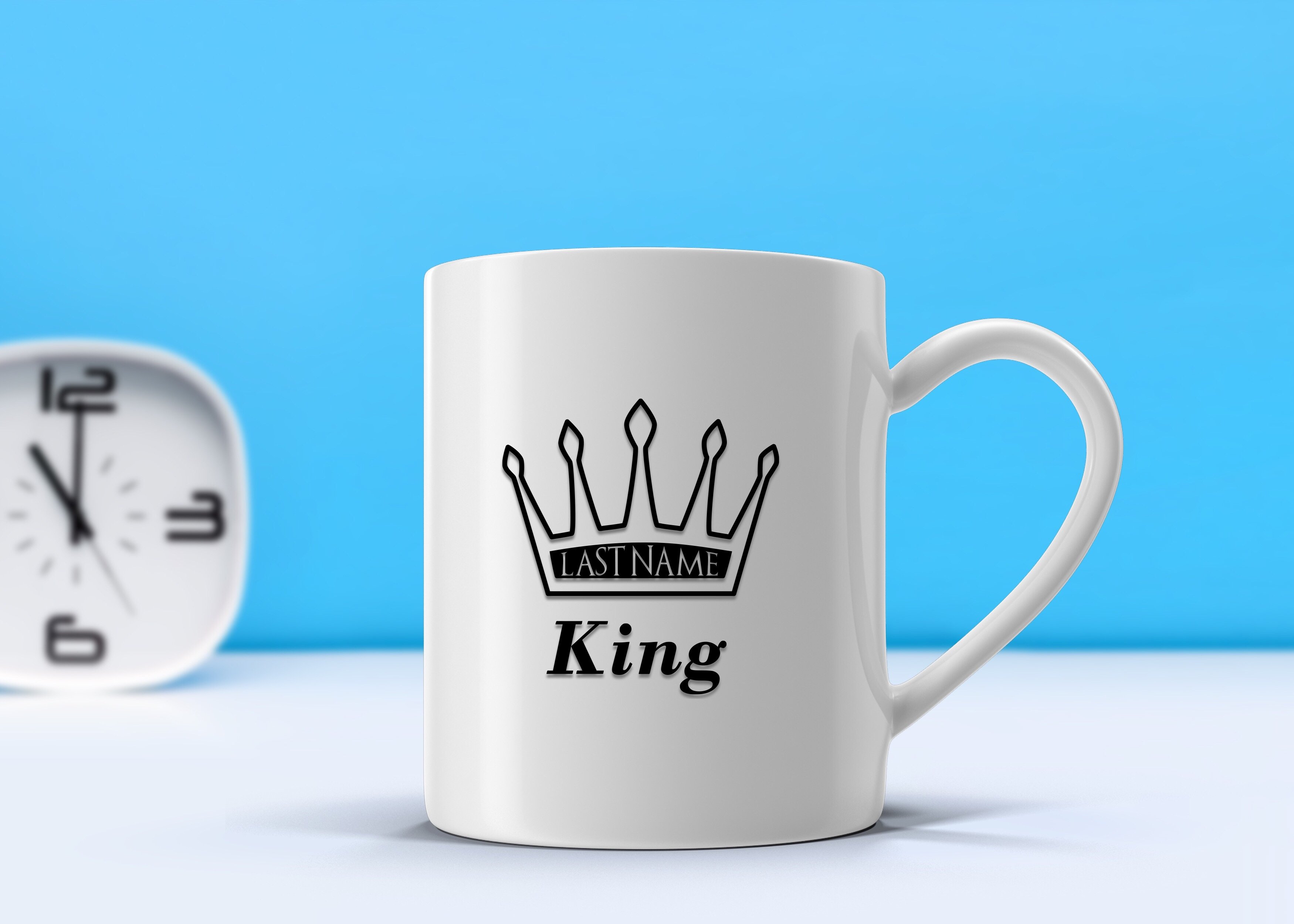 A glossy white ceramic mug featuring the King last name, perfect for coffee or tea.