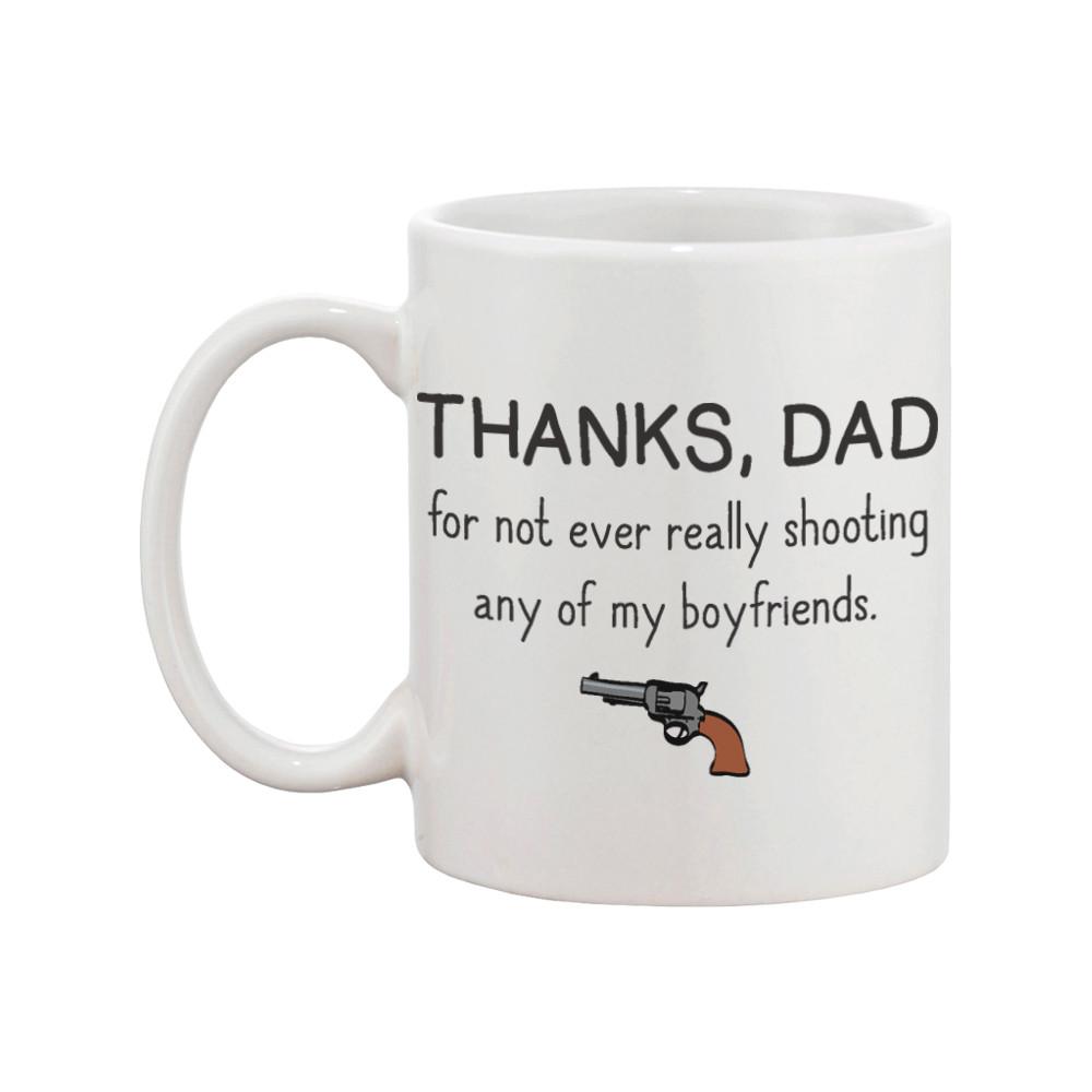 Ceramic mug with humorous text for dads, featuring a classic shape and large C-shaped handle, suitable for hot and cold beverages.