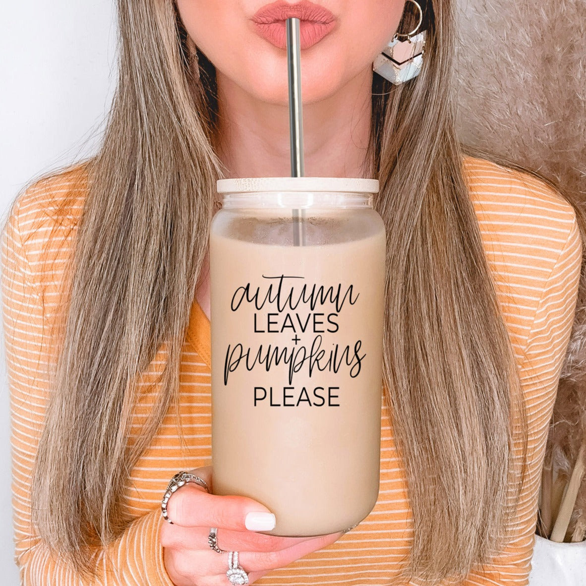 Autumn Leaves Cup featuring a bamboo lid and stainless steel straws, designed for hot and cold beverages with a stylish autumn-themed graphic.