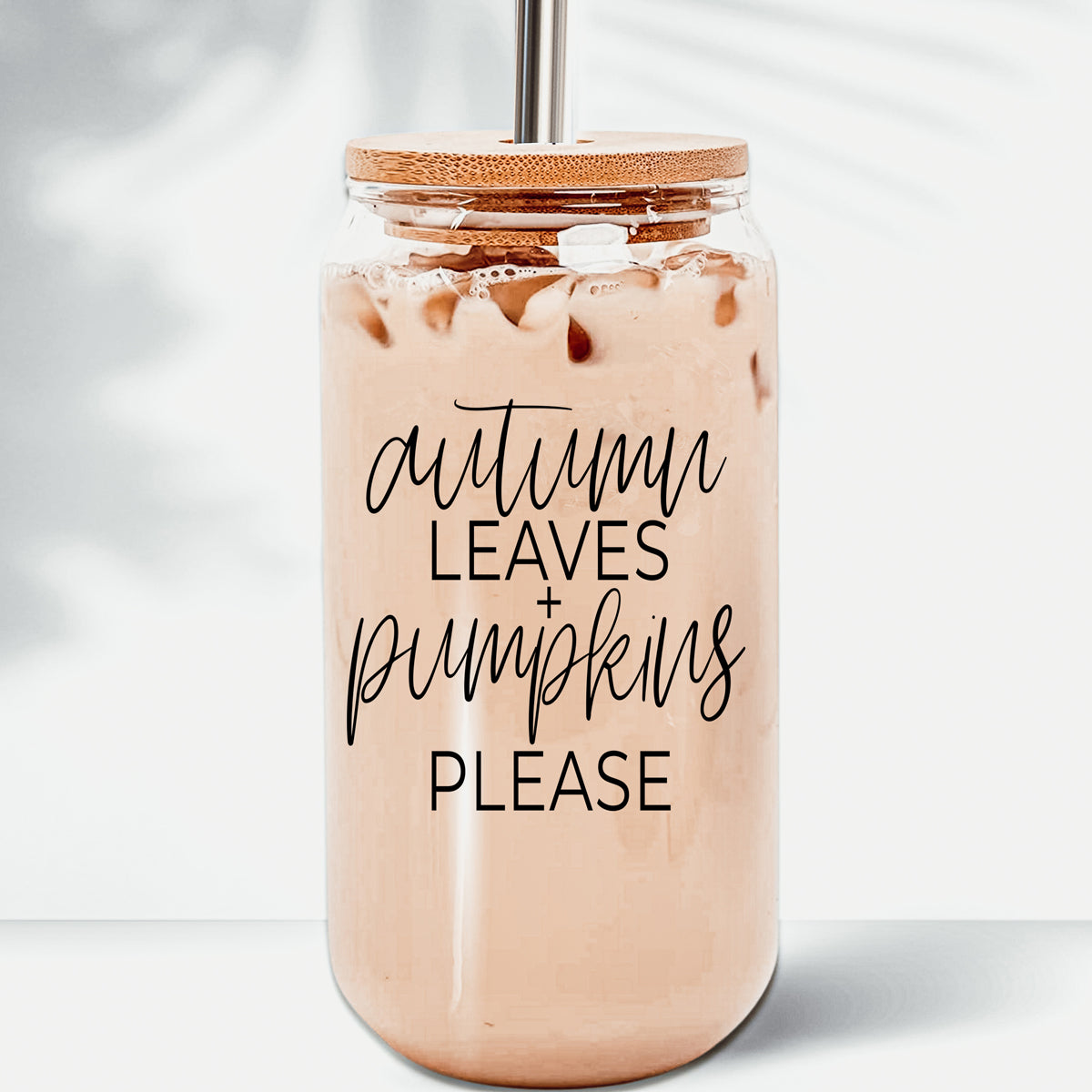 Autumn Leaves Cup featuring a bamboo lid and stainless steel straws, designed for hot and cold beverages with a stylish autumn-themed graphic.