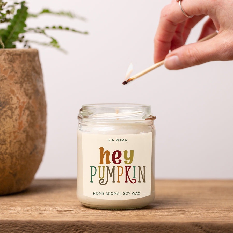 Baked Pumpkin Candle with a gold lid, showcasing a warm pumpkin pie scent and a cozy autumn ambiance.