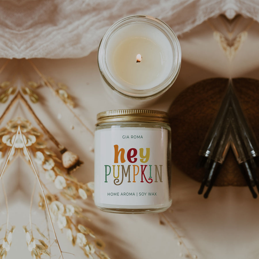 Baked Pumpkin Candle with a gold lid, showcasing a warm pumpkin pie scent and a cozy autumn ambiance.