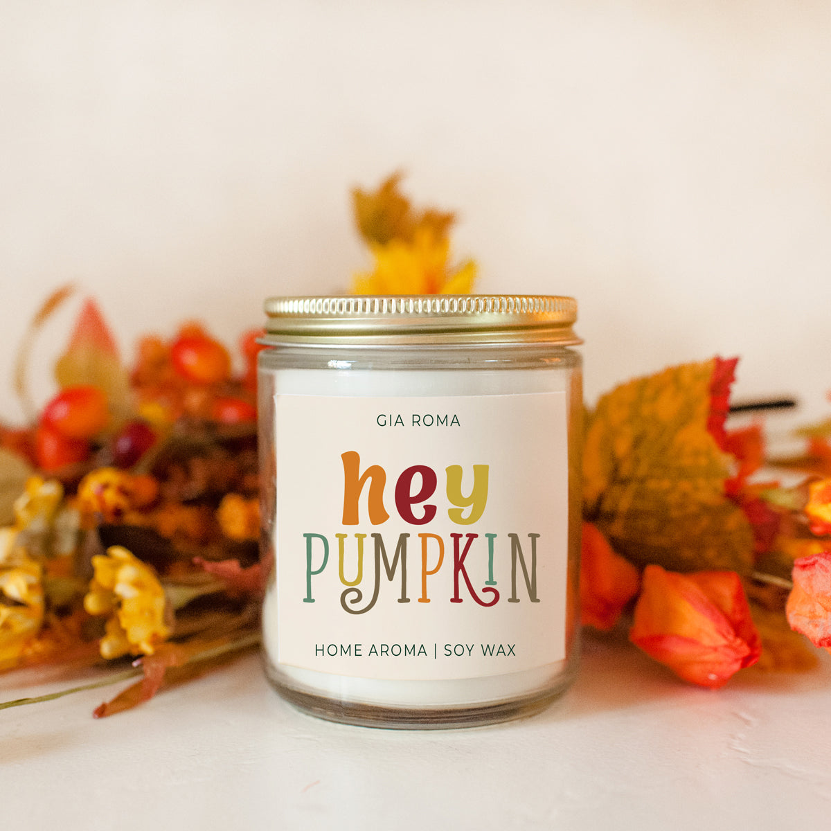 Baked Pumpkin Candle with a gold lid, showcasing a warm pumpkin pie scent and a cozy autumn ambiance.