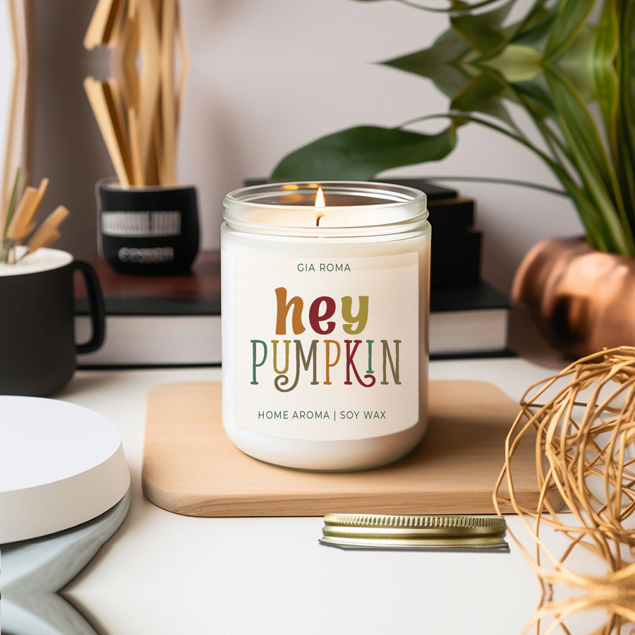 Baked Pumpkin Candle with a gold lid, showcasing a warm pumpkin pie scent and a cozy autumn ambiance.