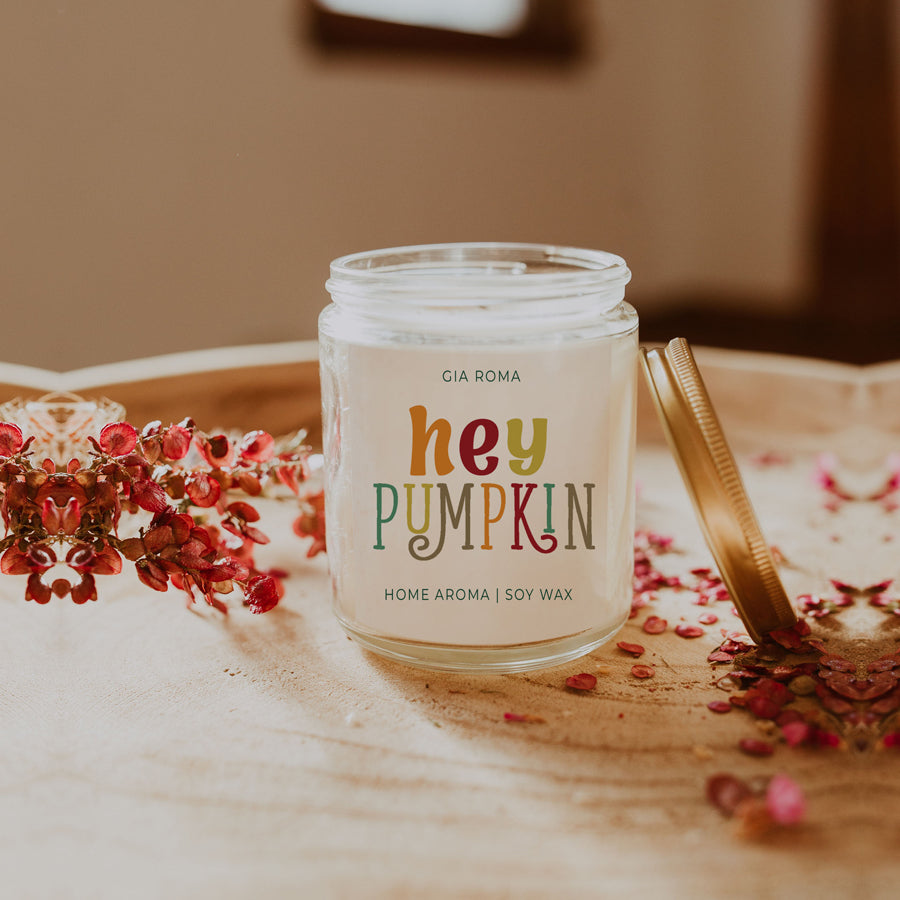 Baked Pumpkin Candle with a gold lid, showcasing a warm pumpkin pie scent and a cozy autumn ambiance.