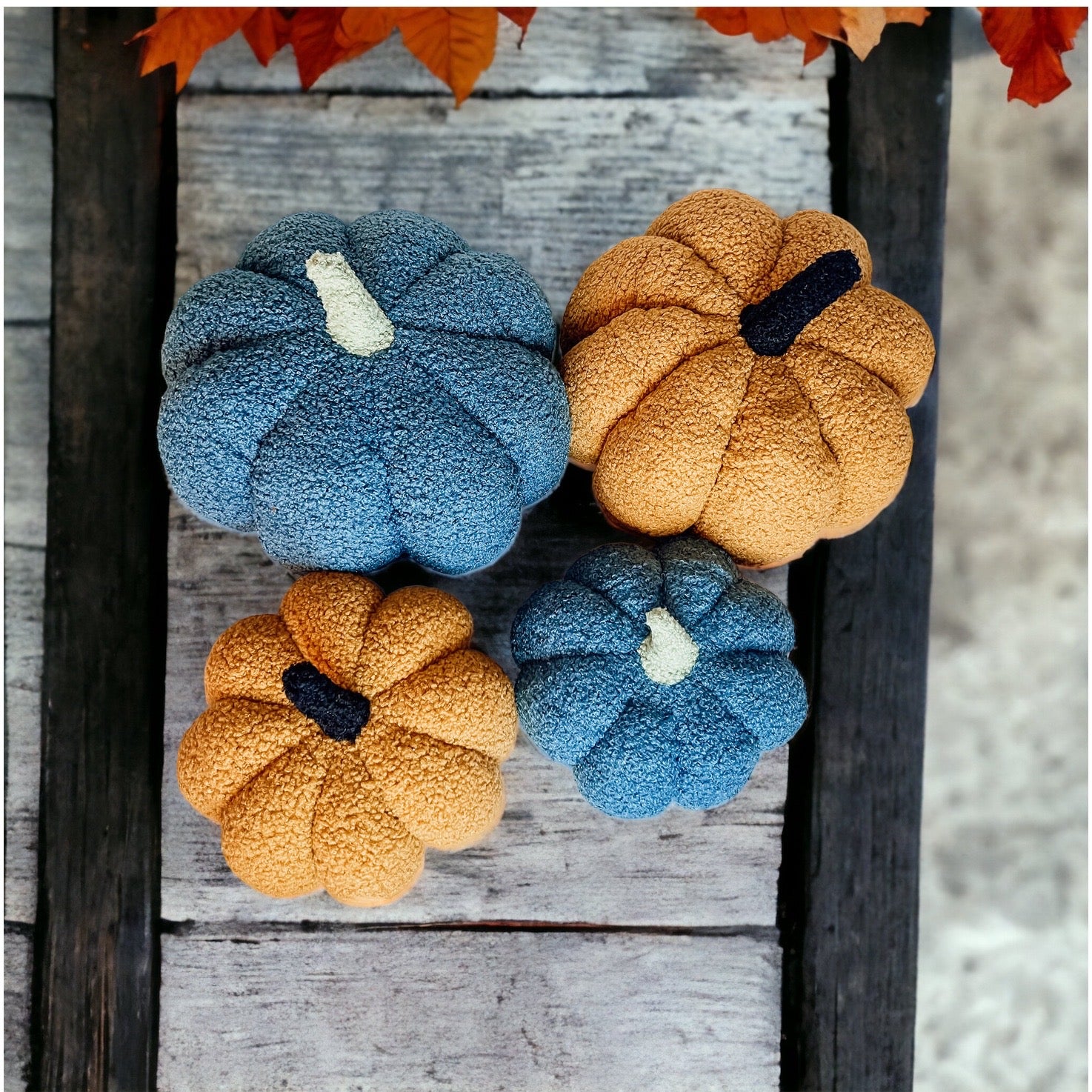 A plush Blair Pumpkin II in vibrant colors, showcasing its soft teddy velvet fabric and charming design, perfect for fall decor.