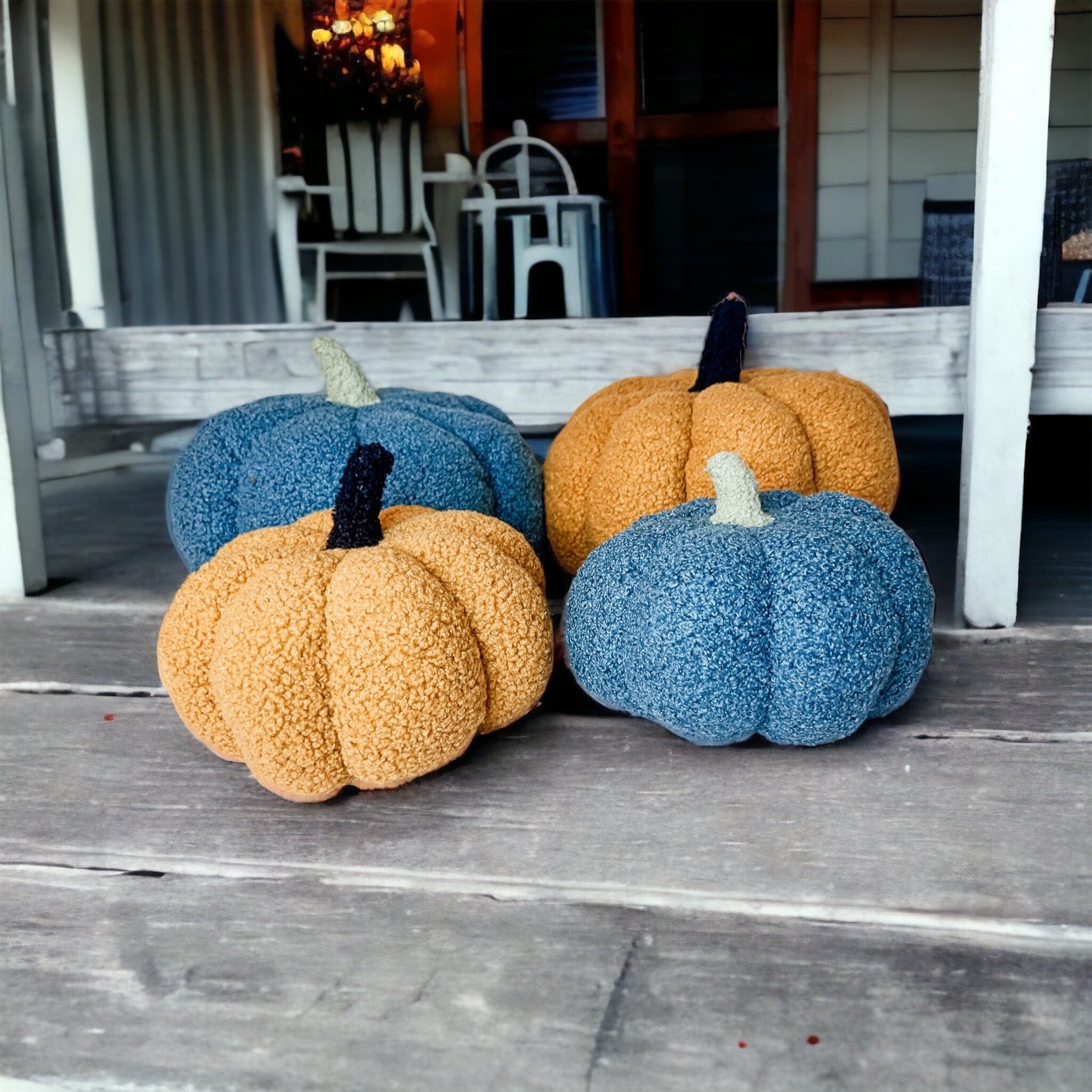 A plush Blair Pumpkin II in vibrant colors, showcasing its soft teddy velvet fabric and charming design, perfect for fall decor.