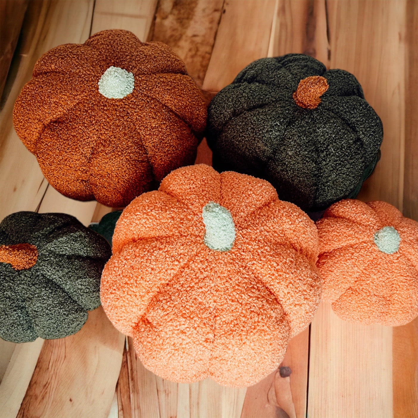 A plush Blair Pumpkin II in vibrant colors, showcasing its soft teddy velvet fabric and charming design, perfect for fall decor.