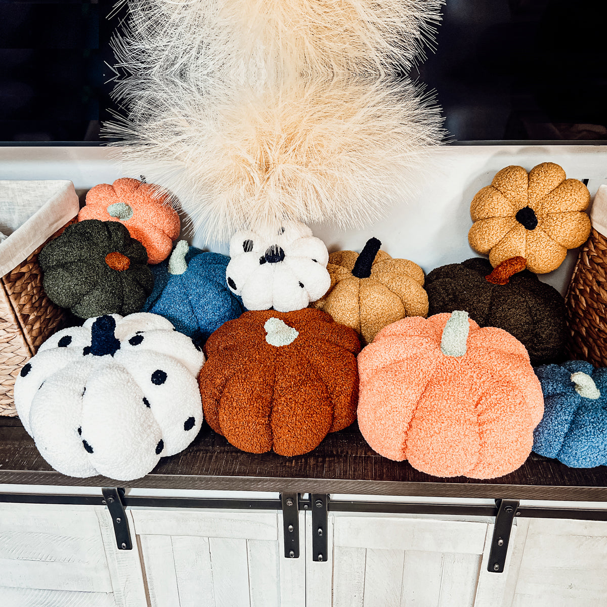 A plush Blair Pumpkin II in vibrant colors, showcasing its soft teddy velvet fabric and charming design, perfect for fall decor.