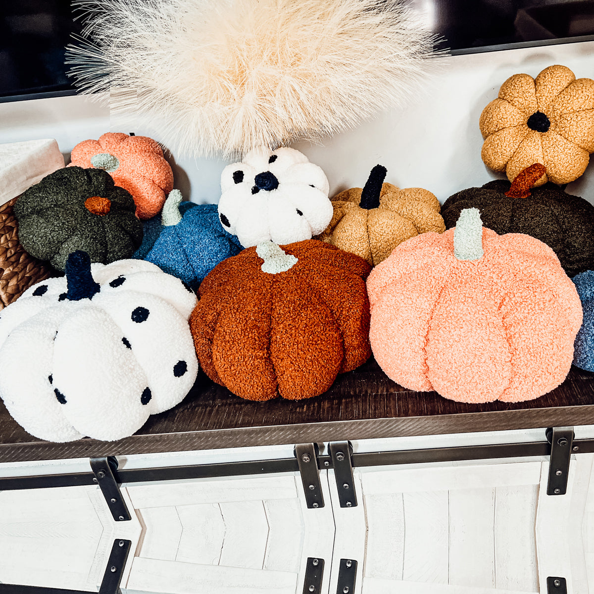 A plush Blair Pumpkin II in vibrant colors, showcasing its soft teddy velvet fabric and charming design, perfect for fall decor.