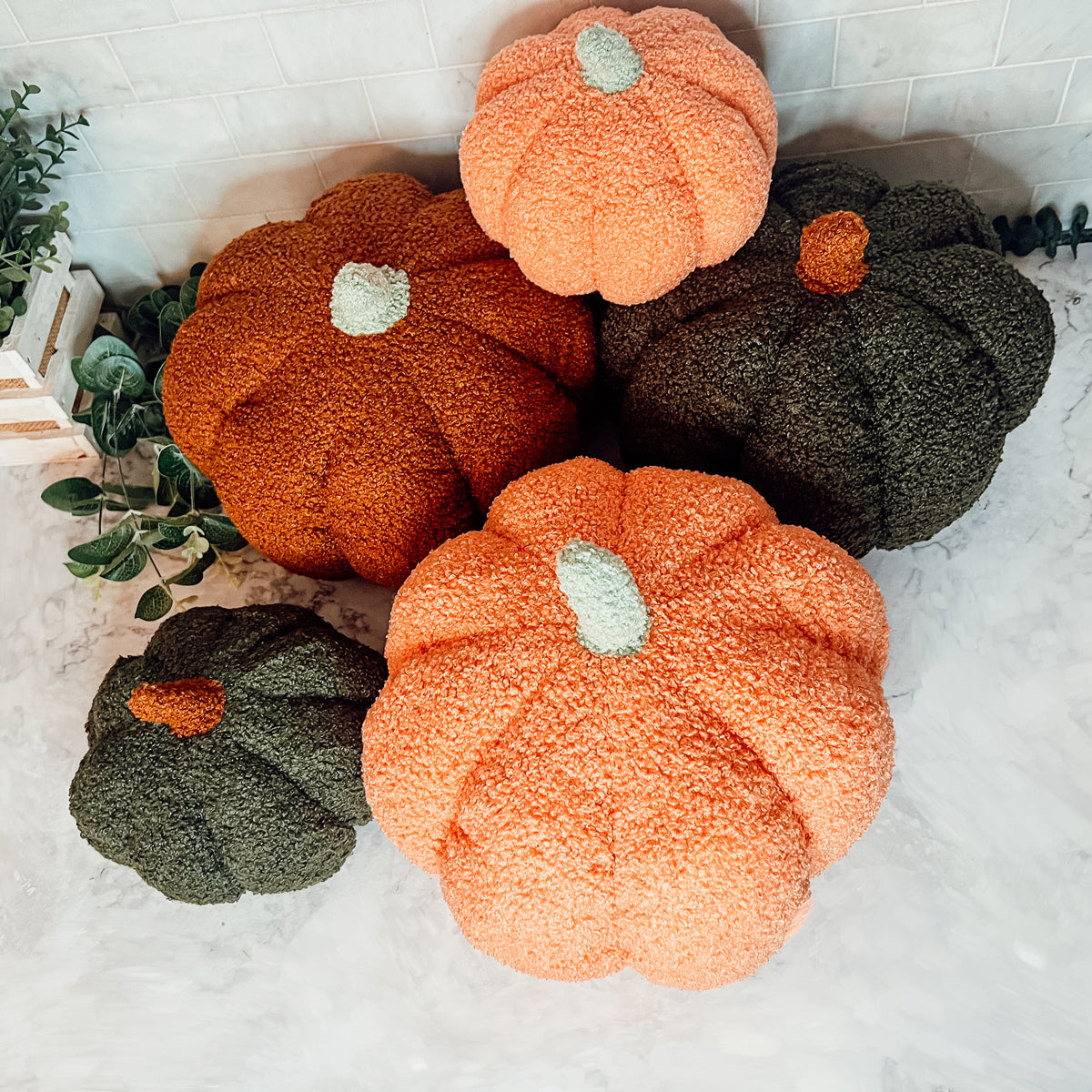 A plush Blair Pumpkin II in vibrant colors, showcasing its soft teddy velvet fabric and charming design, perfect for fall decor.