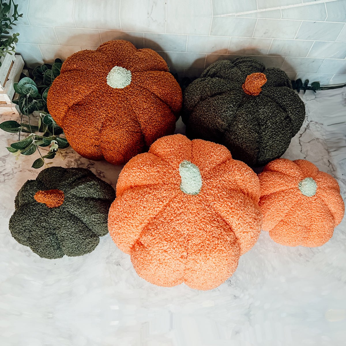 A plush Blair Pumpkin II in vibrant colors, showcasing its soft teddy velvet fabric and charming design, perfect for fall decor.