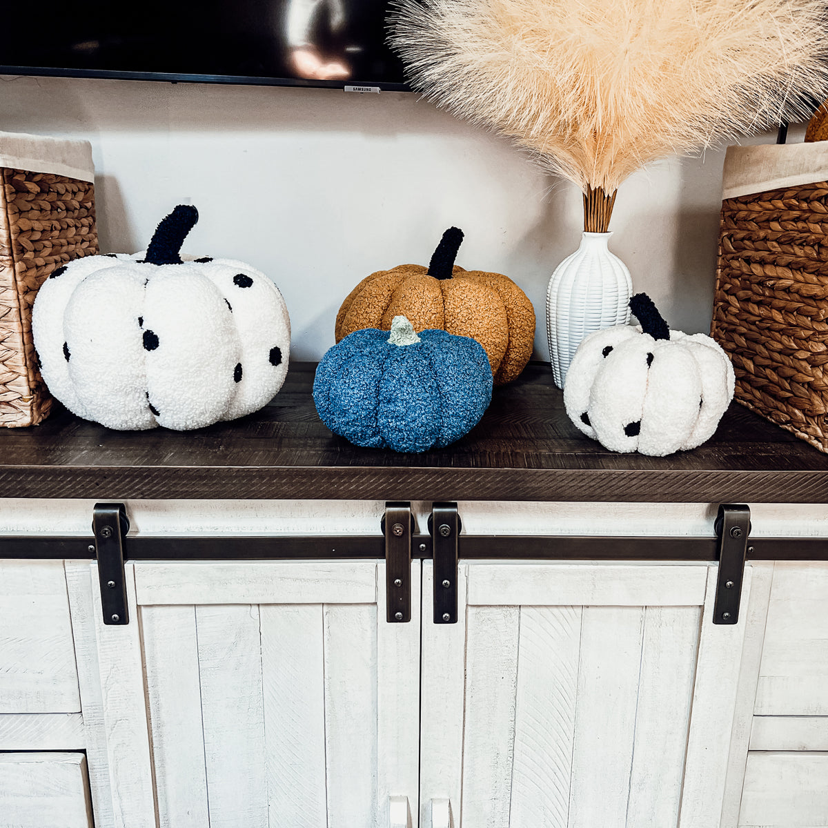 A plush Blair Pumpkin II in vibrant colors, showcasing its soft teddy velvet fabric and charming design, perfect for fall decor.