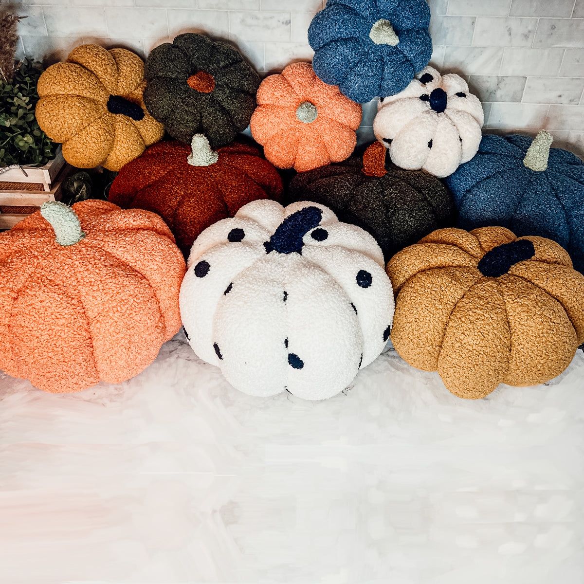 A plush Blair Pumpkin II in vibrant colors, showcasing its soft teddy velvet fabric and charming design, perfect for fall decor.