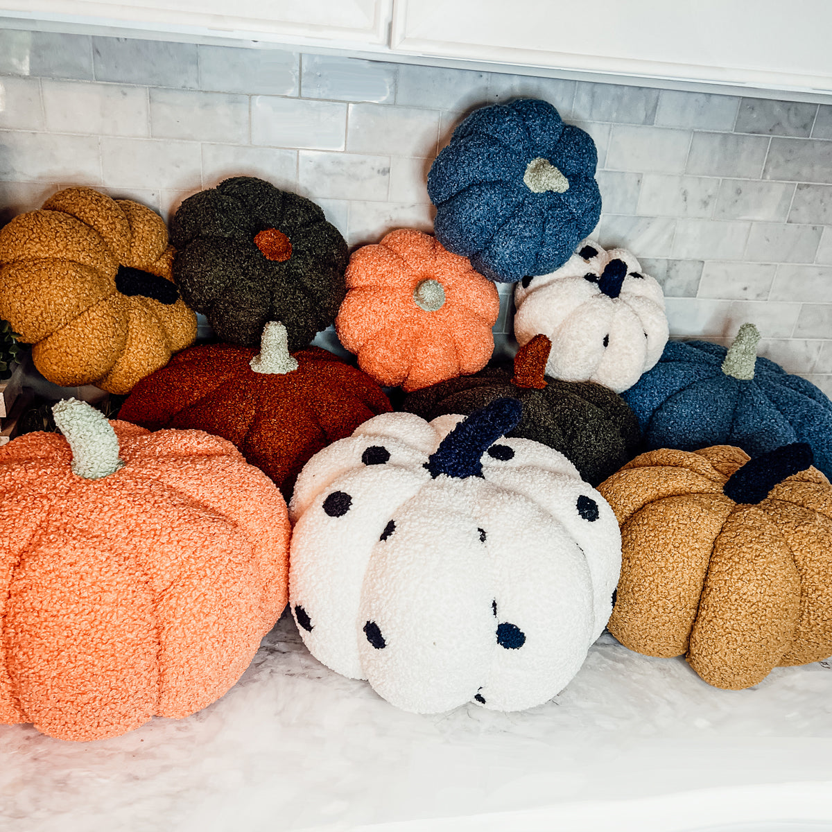 A plush Blair Pumpkin II in vibrant colors, showcasing its soft teddy velvet fabric and charming design, perfect for fall decor.