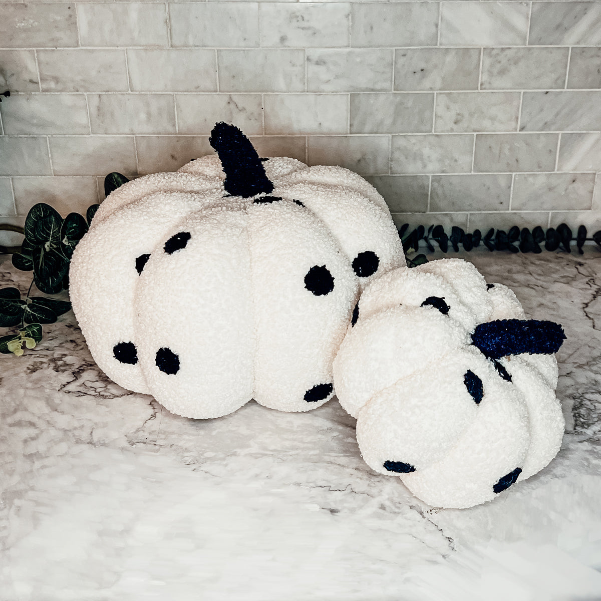 A plush Blair Pumpkin II in vibrant colors, showcasing its soft teddy velvet fabric and charming design, perfect for fall decor.