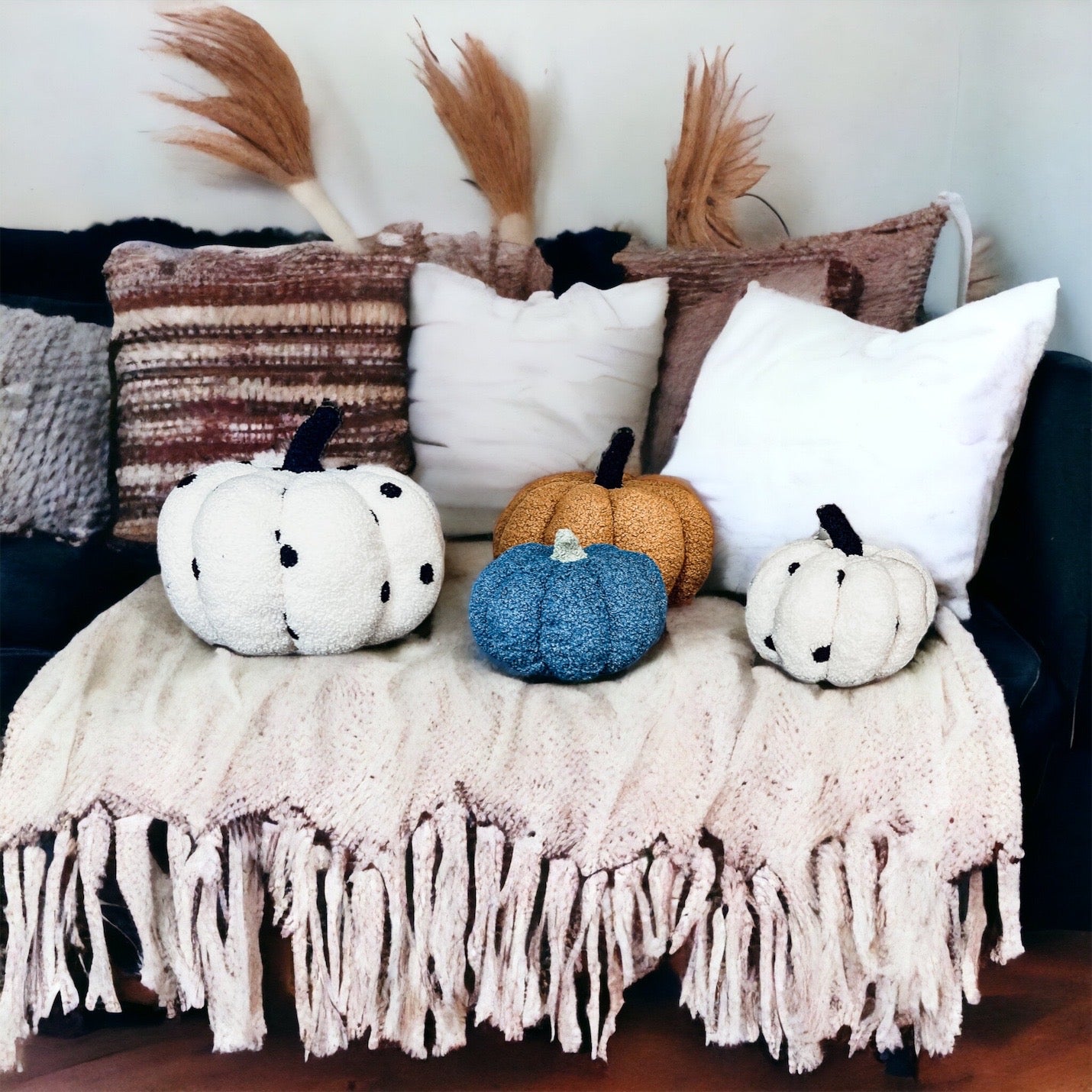 A plush Blair Pumpkin II in vibrant colors, showcasing its soft teddy velvet fabric and charming design, perfect for fall decor.