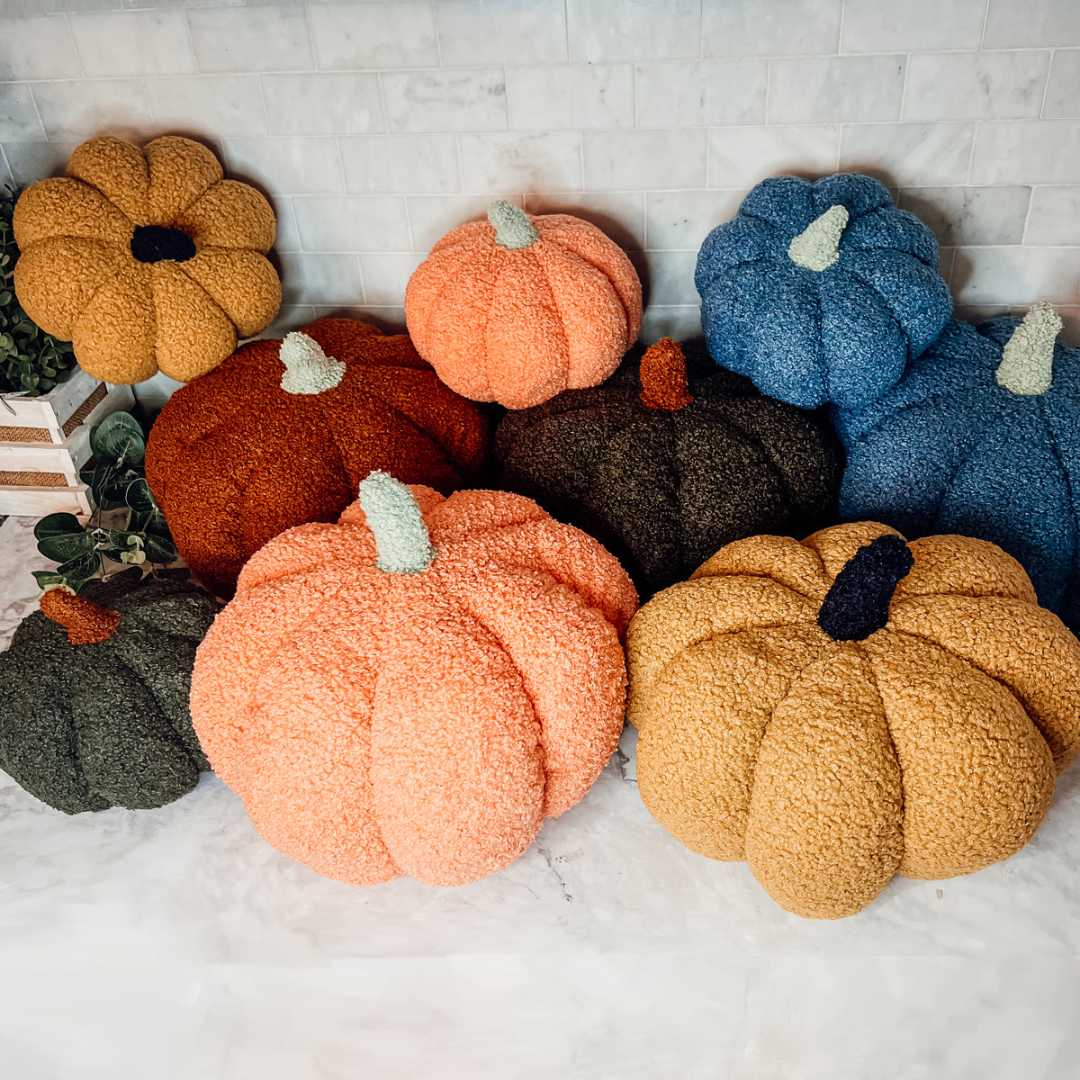 A plush Blair Pumpkin II in vibrant colors, showcasing its soft teddy velvet fabric and charming design, perfect for fall decor.