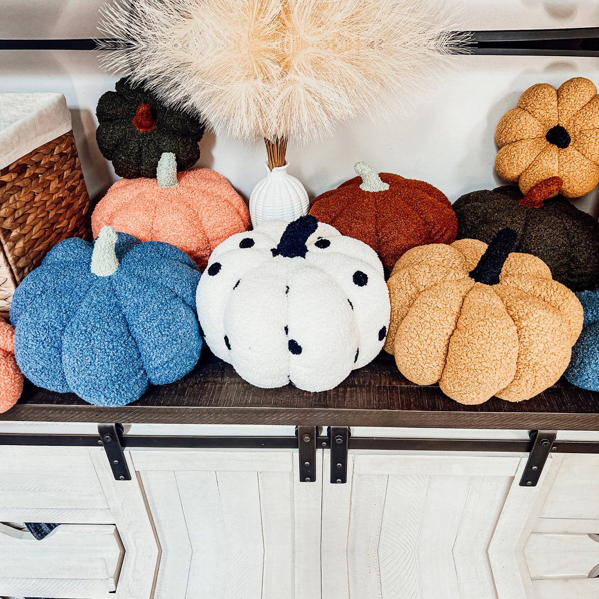 A plush Blair Pumpkin II in vibrant colors, showcasing its soft teddy velvet fabric and charming design, perfect for fall decor.