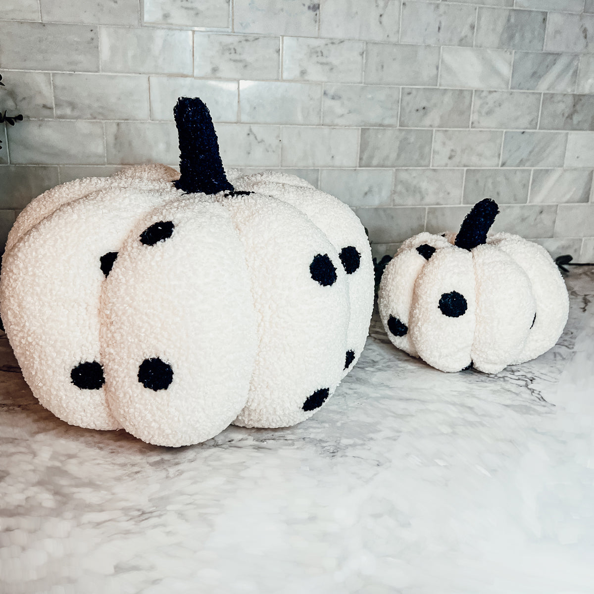 A plush Blair Pumpkin II in vibrant colors, showcasing its soft teddy velvet fabric and charming design, perfect for fall decor.