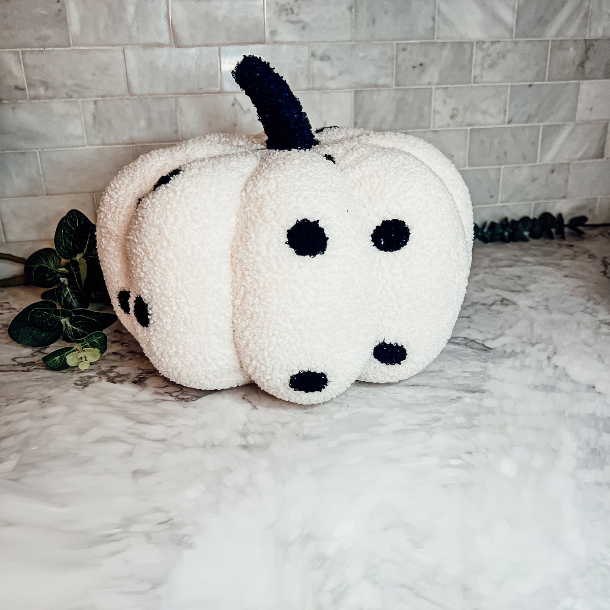 A plush Blair Pumpkin II in vibrant colors, showcasing its soft teddy velvet fabric and charming design, perfect for fall decor.