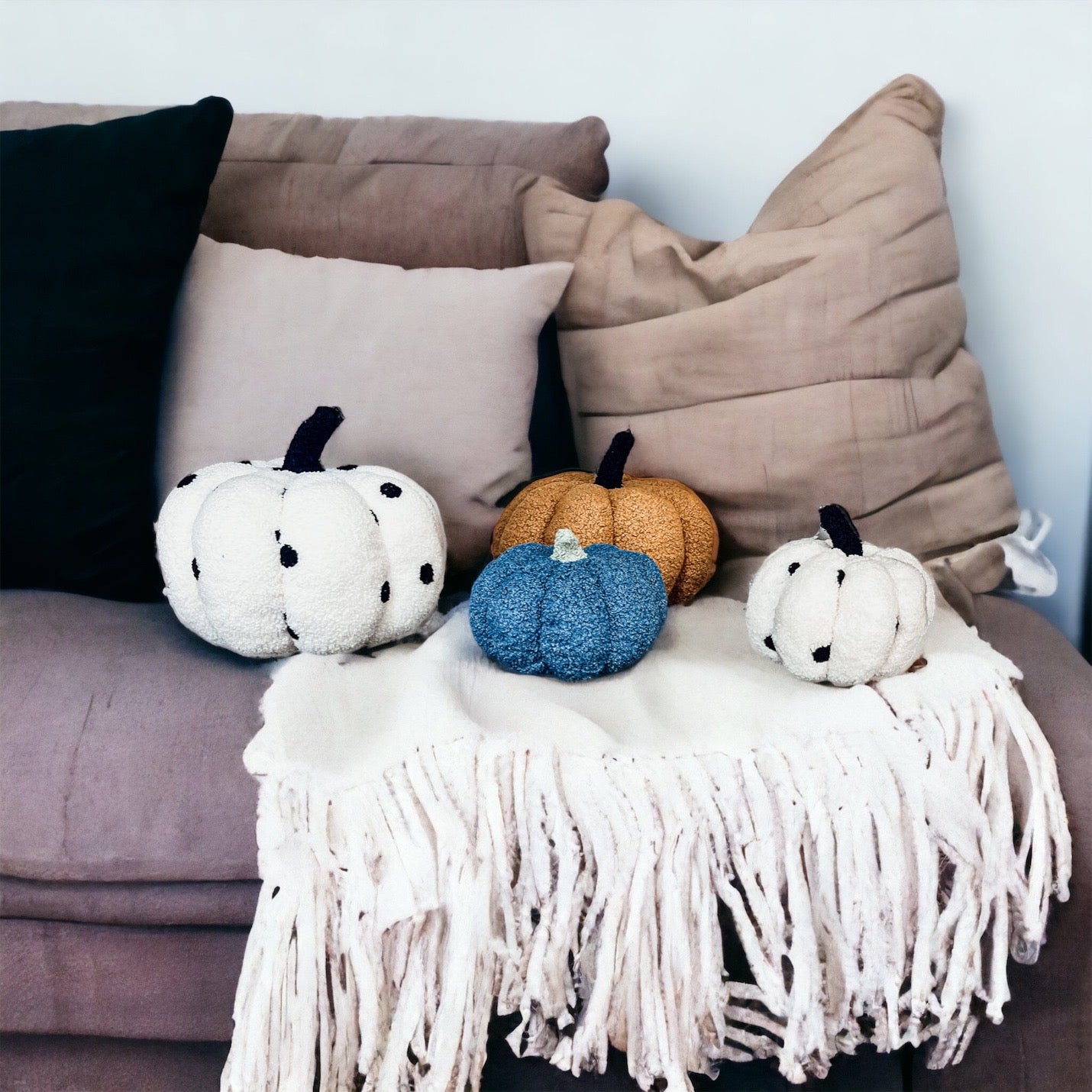 A plush Blair Pumpkin II in vibrant colors, showcasing its soft teddy velvet fabric and charming design, perfect for fall decor.