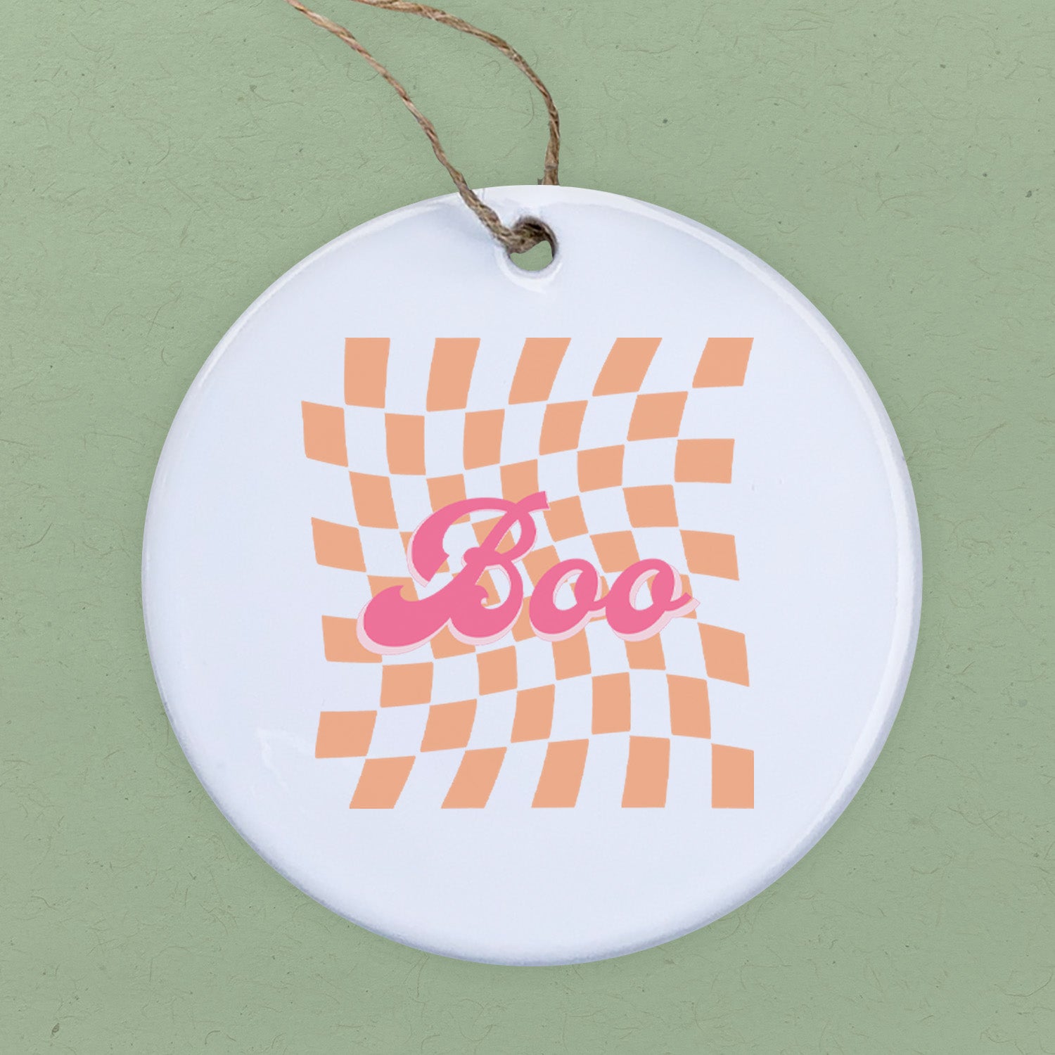 Boo Orange Check Ornament made of high-quality porcelain with a vibrant orange check design, perfect for gifting or decoration.