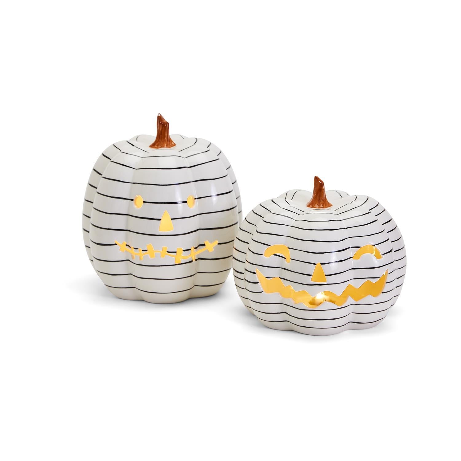 A hand-painted black and white LED pumpkin with a contemporary striped design, perfect for Halloween decor.