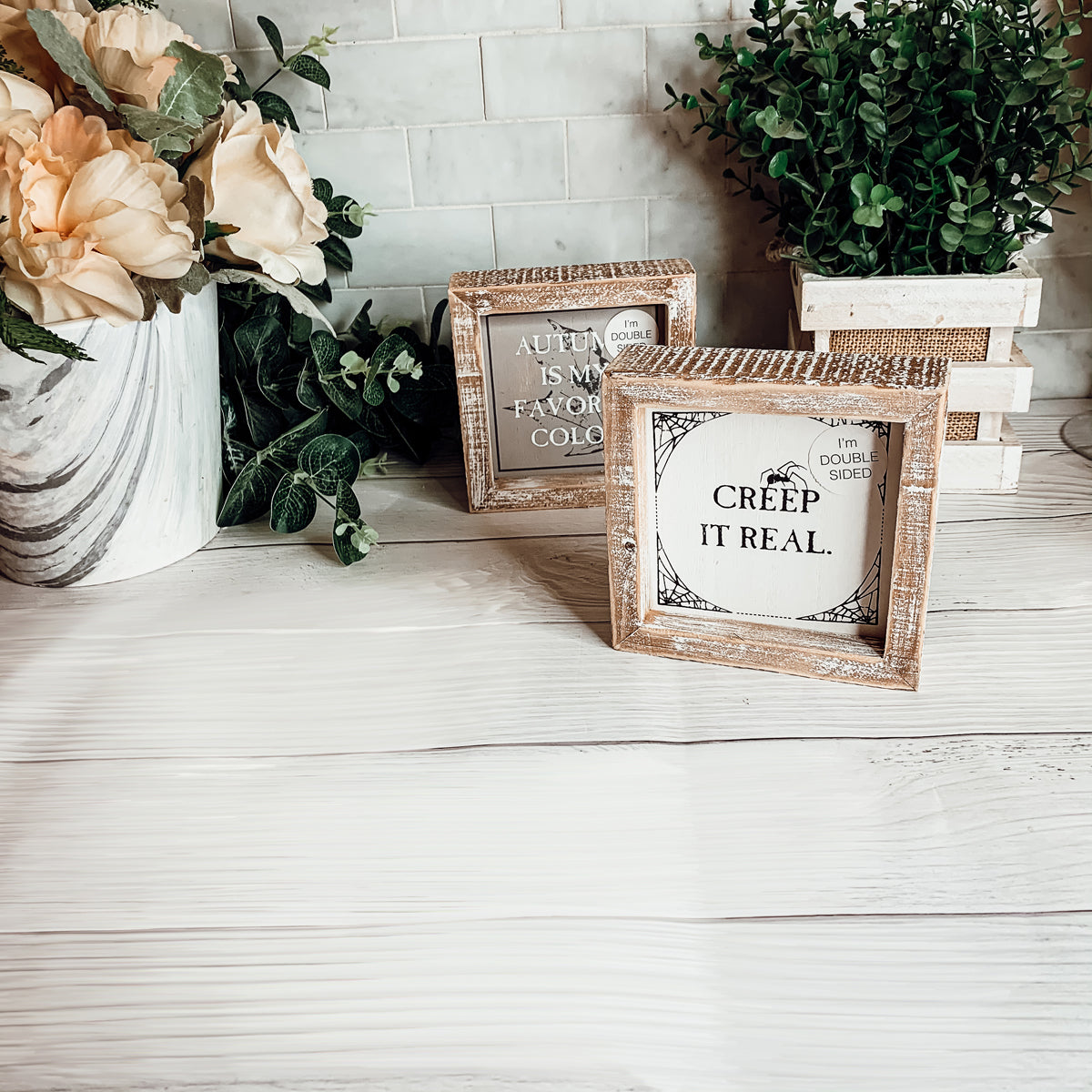 Creep + Autumn double-sided wooden sign featuring 'Creep it real' and 'Autumn is my favorite color' designs, perfect for seasonal decor.