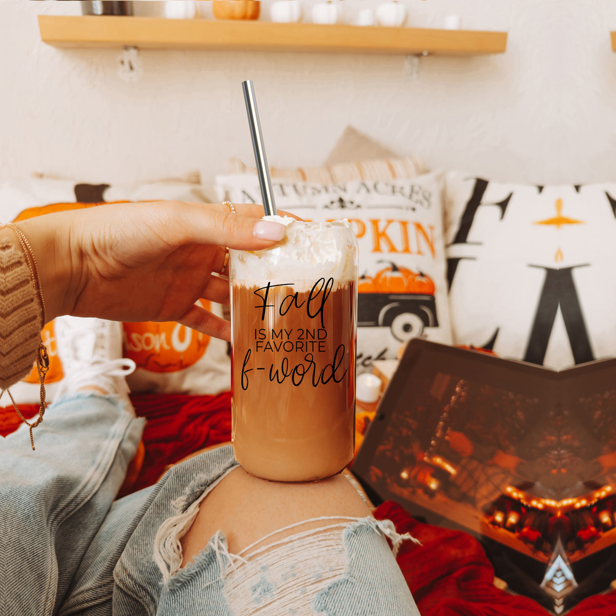 A stylish Fall F-Word Cup made of high borosilicate glass with a bamboo lid, featuring a black graphic text that reads 'FALL IS MY 2ND FAVORITE F-WORD', accompanied by stainless steel straws.