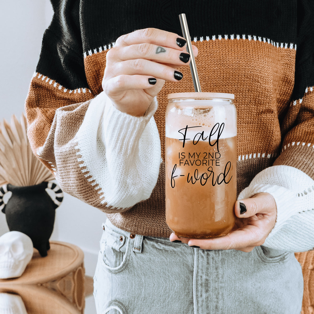 A stylish Fall F-Word Cup made of high borosilicate glass with a bamboo lid, featuring a black graphic text that reads 'FALL IS MY 2ND FAVORITE F-WORD', accompanied by stainless steel straws.