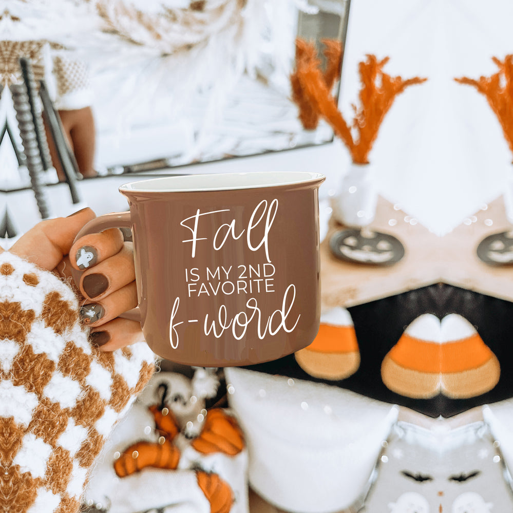 A stylish Fall + F-Word Mug featuring a neutral brown tone and white lettering, designed for cozy autumn beverages.