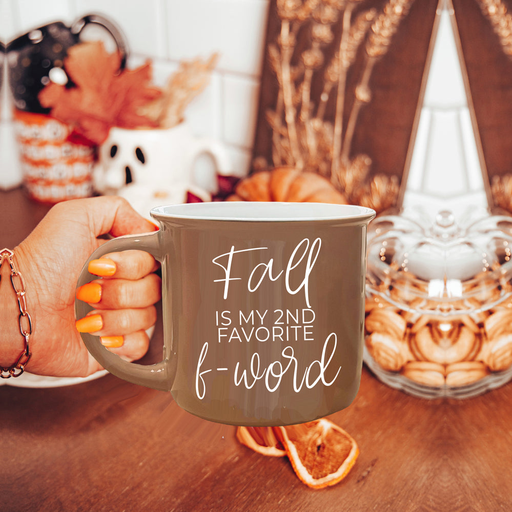 A stylish Fall + F-Word Mug featuring a neutral brown tone and white lettering, designed for cozy autumn beverages.