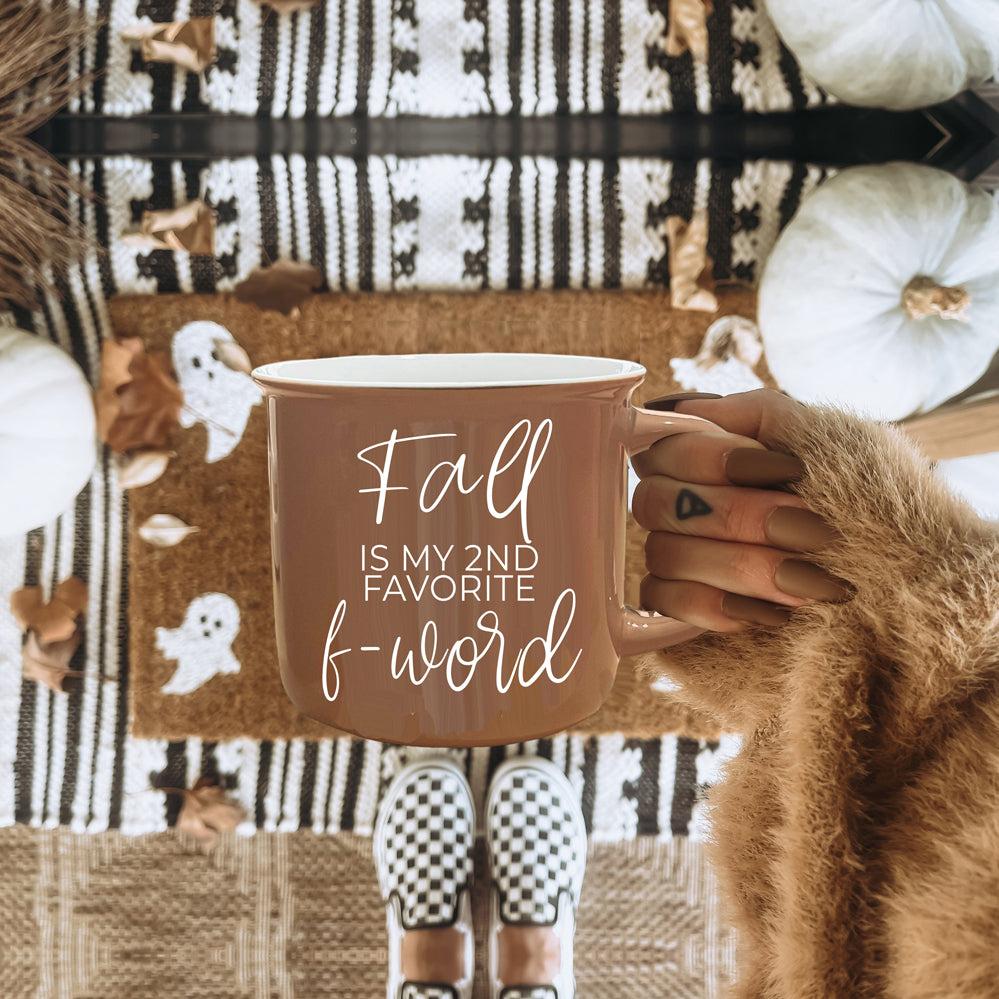 A stylish Fall + F-Word Mug featuring a neutral brown tone and white lettering, designed for cozy autumn beverages.