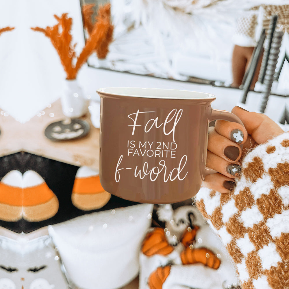 A stylish Fall + F-Word Mug featuring a neutral brown tone and white lettering, designed for cozy autumn beverages.