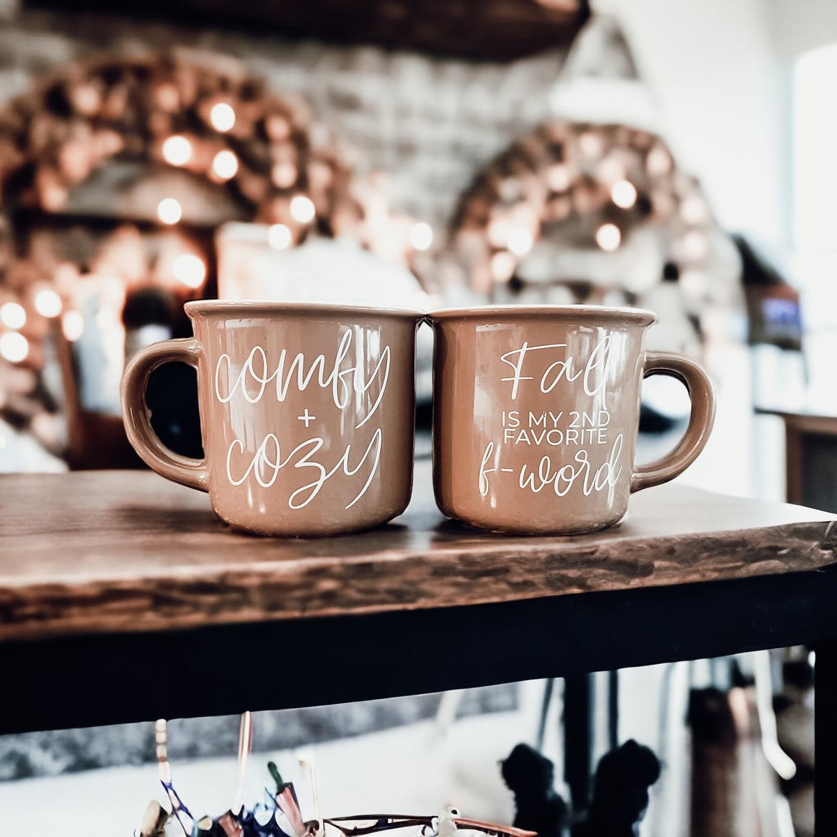 A stylish Fall + F-Word Mug featuring a neutral brown tone and white lettering, designed for cozy autumn beverages.