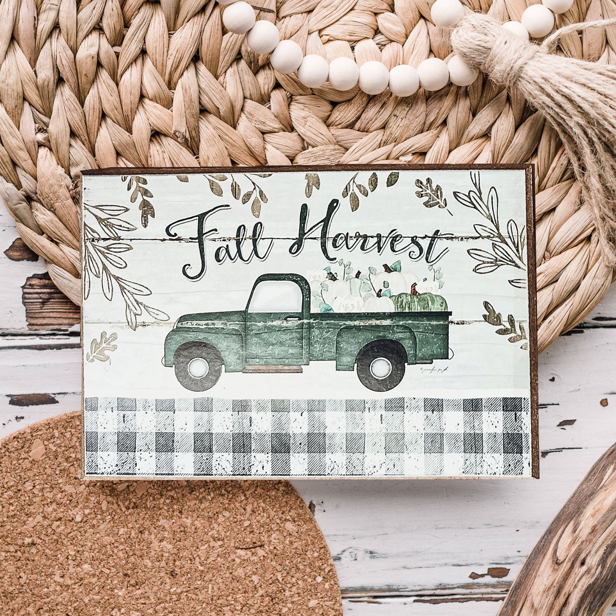 A rustic Fall Harvest sign made of thick wood, featuring autumn-themed designs, perfect for home decor during fall and Halloween.