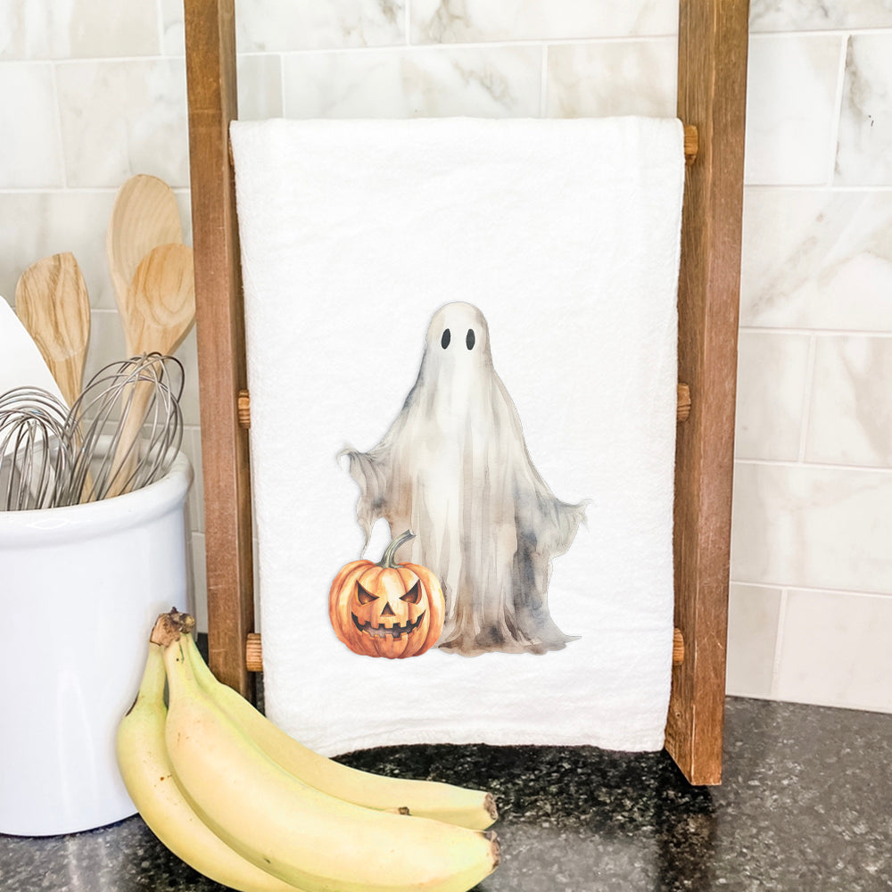 A vibrant cotton tea towel featuring playful ghosts and pumpkins, perfect for Halloween decor.