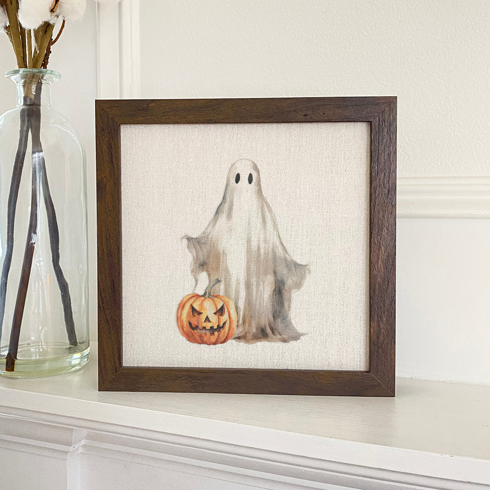 Ghost and Pumpkin framed sign with a stylized wood frame, featuring eco-friendly printing on a linen-look background.