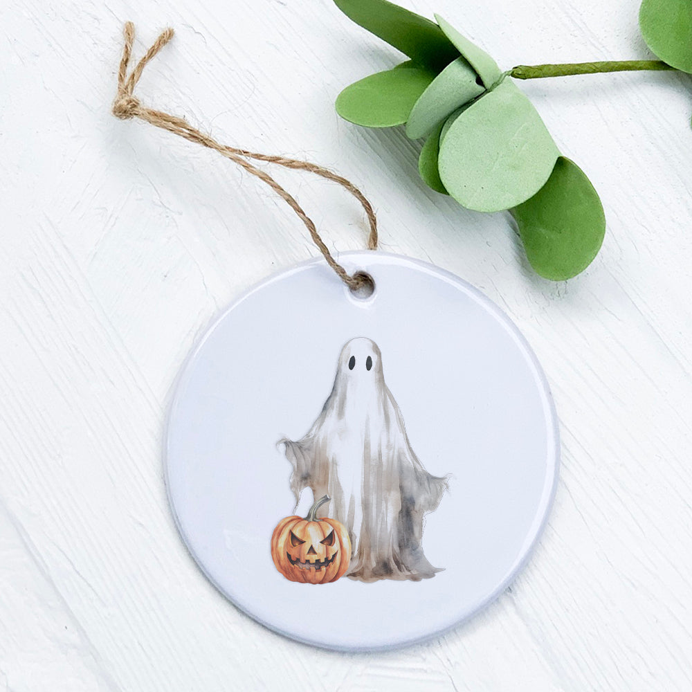 A beautifully crafted porcelain ornament featuring a ghost and pumpkin design, perfect for seasonal decor.