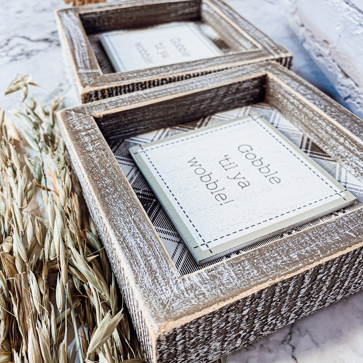 A charming Gobble Til Ya Wobble sign, perfect for Thanksgiving decor, featuring playful lettering on a compact wooden base.