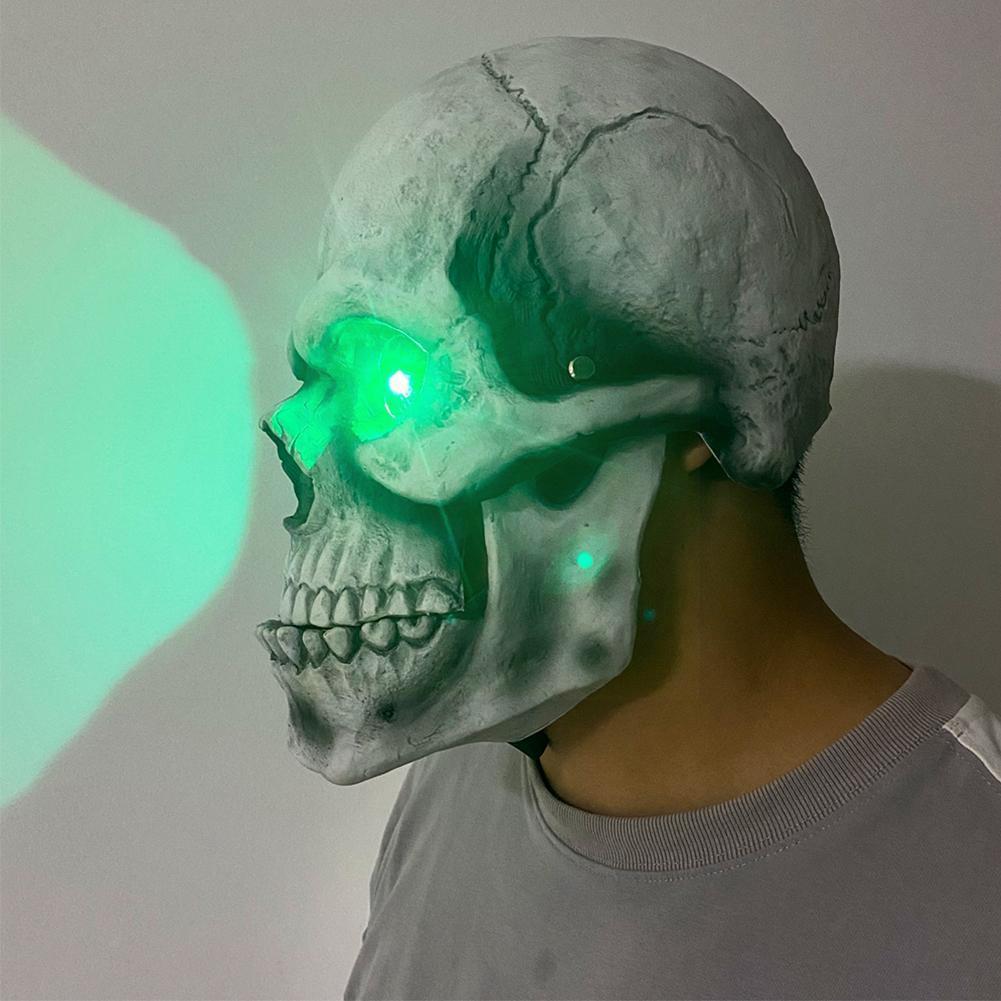 A realistic Halloween Skull Movable Mouth Latex Mask featuring intricate skull plating, sunken dark eye sockets, and a jagged smile, perfect for Halloween events.