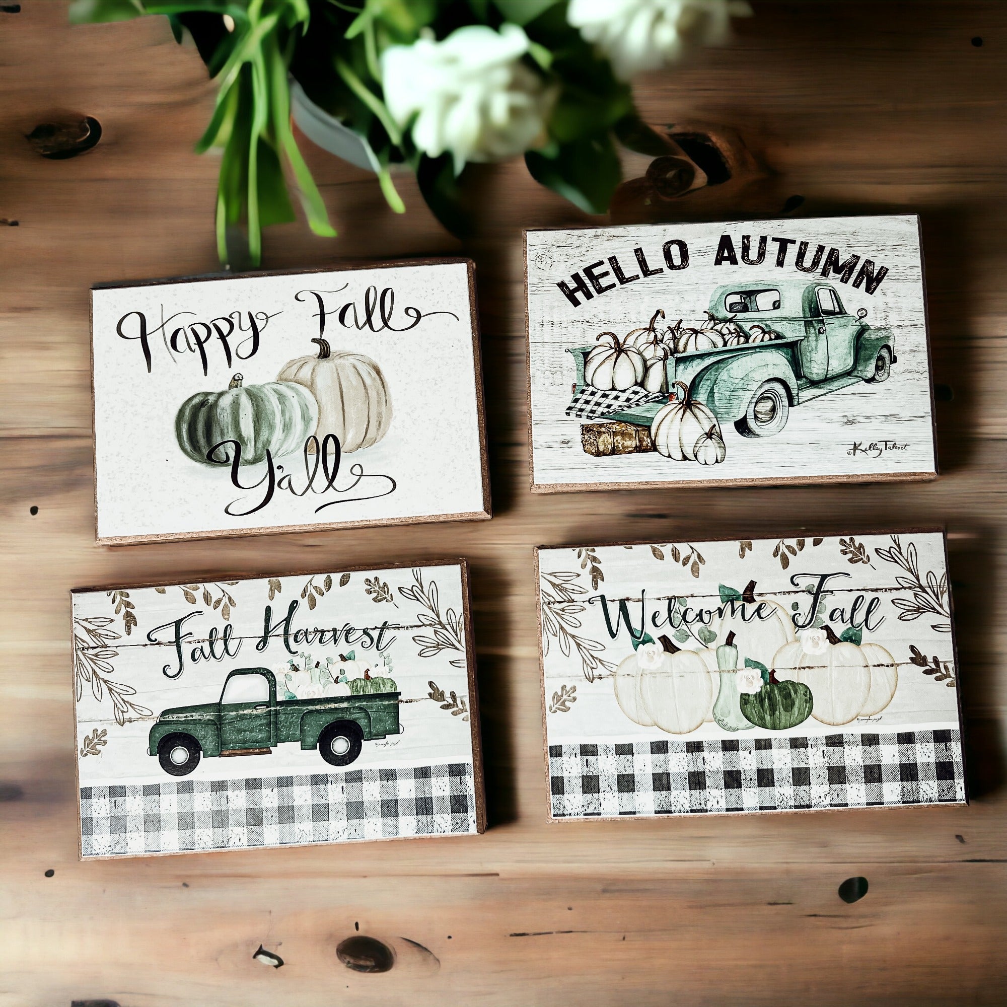 A charming wooden sign that reads 'Happy Fall Y'all' in pastel colors on an off-white background, perfect for autumn decor.